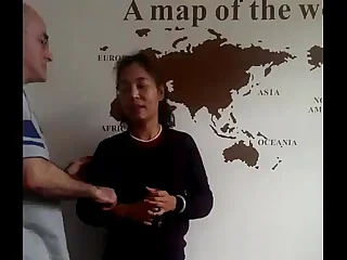 American man and his Chinese wife and a Chinese boy three rows Dongguan